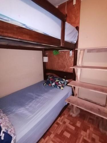 Ένα ή περισσότερα κρεβάτια σε δωμάτιο στο Intihuatana Hostel