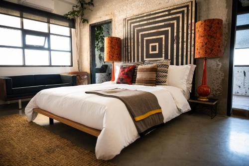 Postel nebo postele na pokoji v ubytování Hotel Boutique Lafayette Tijuana