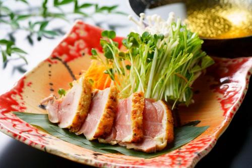 a plate of food with ham and vegetables on it at Hotel Beppu Pastoral in Beppu