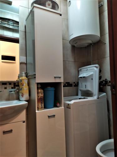 a small kitchen with a sink and a microwave at NEW STUDIO MUO in Kotor