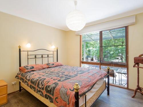 Postel nebo postele na pokoji v ubytování Caseys Pet Friendly Beach Cottage