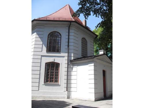 a white building with a red roof at SORAT Hotel Cottbus in Cottbus