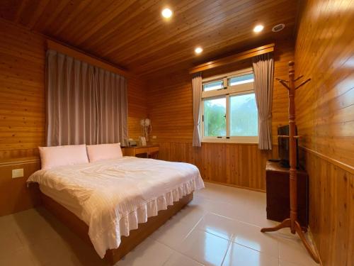 Voodi või voodid majutusasutuse Tianyi Homestay toas