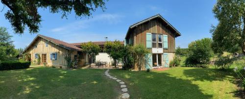 a house with a garden in front of it at Majellon in Sainte-Christie-dʼArmagnac