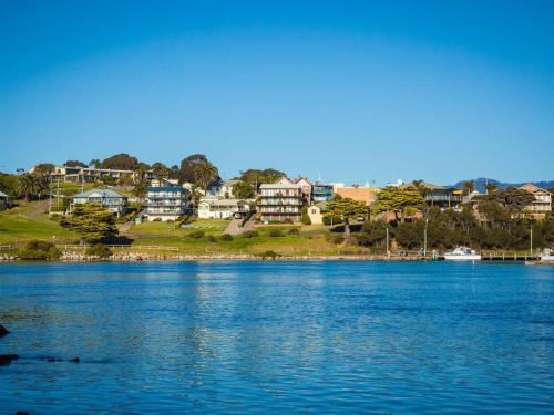 a view of a large body of water with houses at Pacific Pines Unit 4 in Narooma