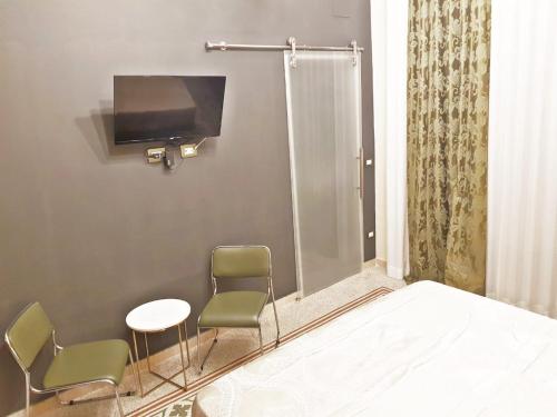 TV a/nebo společenská místnost v ubytování Room in BB - Princess Mafalda of Savoy b b