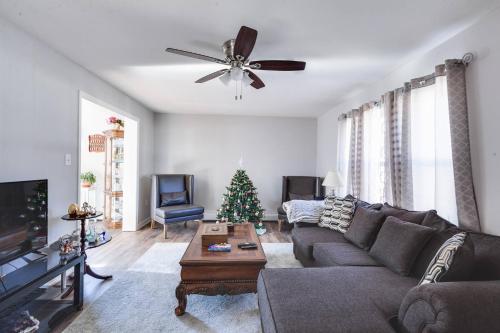 a living room with a couch and a christmas tree at Dont Get Stucked In Boston Traffic in New Bedford