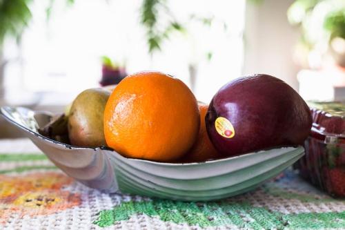 a bowl of fruit sitting on a table at Dont Get Stucked In Boston Traffic in New Bedford