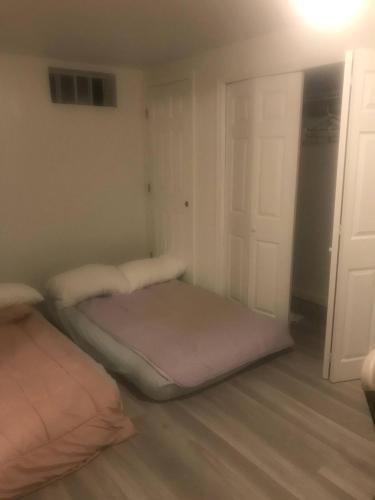 a room with two beds in a room with a door at Dont Get Stucked In Boston Traffic in New Bedford