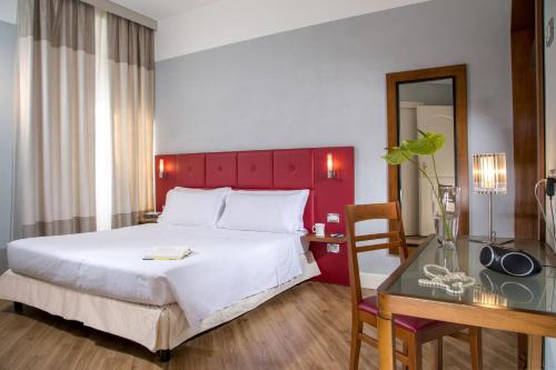 Una cama o camas en una habitación de Best Western Hotel Astrid