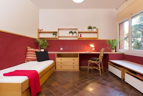a room with two beds and a desk in it at El Chalet del Montseny in Seva