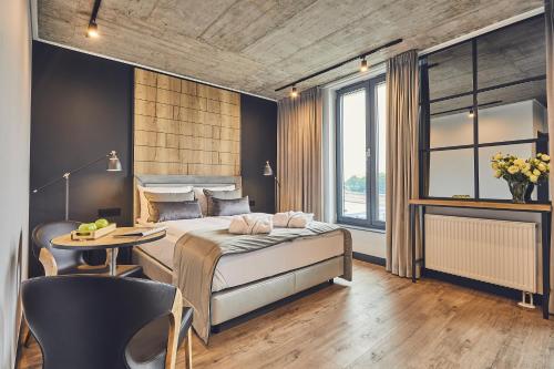 Krevet ili kreveti u jedinici u objektu The Bridge Suites