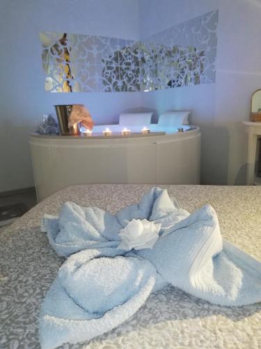 a blue towel on a bed in a room at Blue House Varenna in Varenna