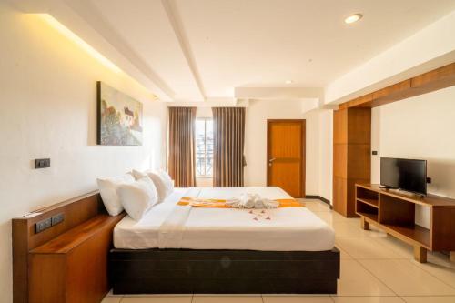 Tempat tidur dalam kamar di Baywalk Residence Pattaya