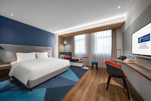 Säng eller sängar i ett rum på Holiday Inn Express Rongcheng Science and Technology Park