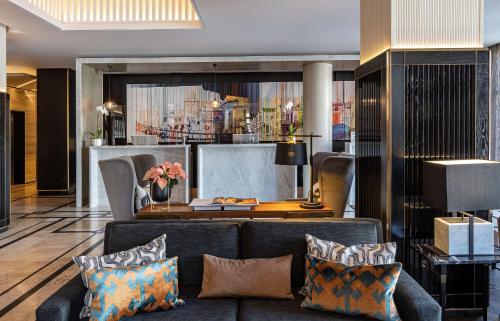a living room with a couch and a table at Hyatt Regency Cape Town in Cape Town