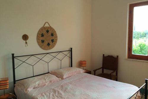 Tempat tidur dalam kamar di Villa panoramica nel golfo Asinara