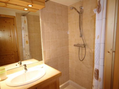 a bathroom with a sink and a shower at Appartement Les Saisies, 2 pièces, 4 personnes - FR-1-293-159 in Les Saisies