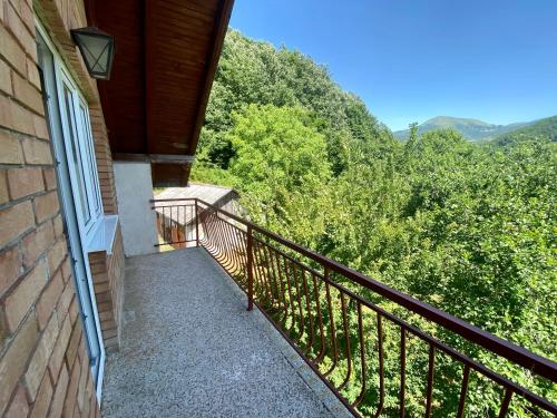 a balcony of a house with a view of the mountains at Vila Vidak in Mojkovac