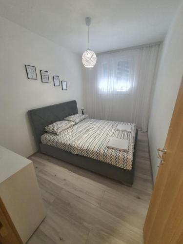 Кровать или кровати в номере JOX Apartment