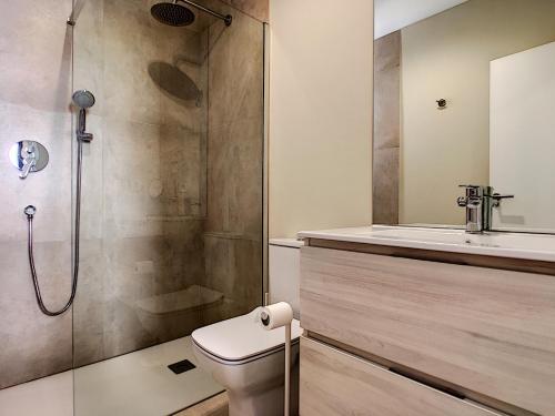 a bathroom with a shower and a toilet and a sink at Villas Alamos - 4509 in Mar de Cristal