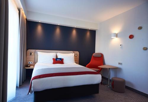 Кровать или кровати в номере Holiday Inn Express Amsterdam - City Hall by IHG