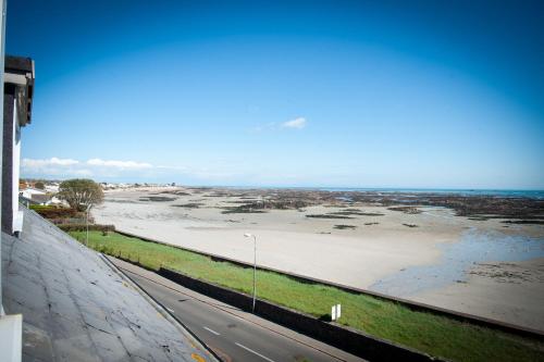 a view of a beach and the ocean from a building at Pontac House Hotel in St Clements