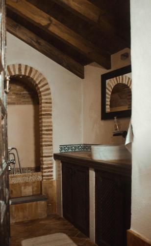 a bathroom with a sink and a mirror at Fery & Nico in Granada