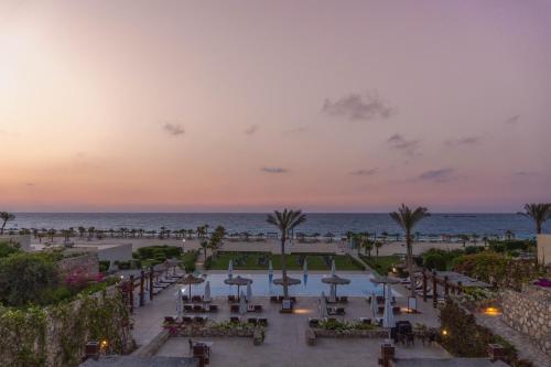 a view of the beach from the resort at sunset at Caesar Bay Resort in Marsa Matruh