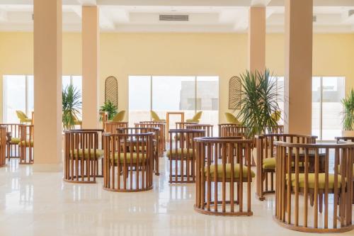 a row of chairs and tables in a room at Caesar Bay Resort in Marsa Matruh