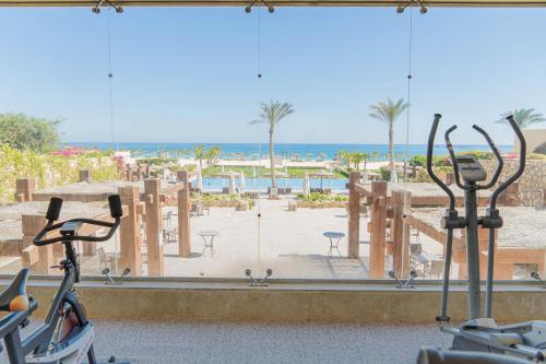 a view of a gym with a view of the beach at Caesar Bay Resort in Marsa Matruh