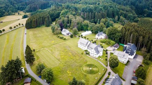 an aerial view of a large house with a park at St. Bonifatius in Winterberg