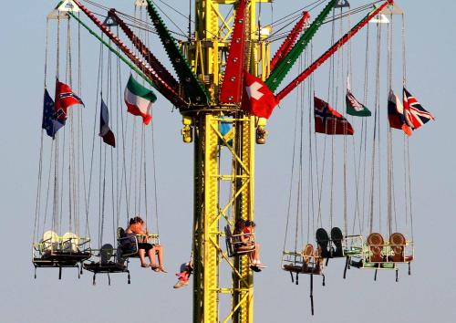 a group of people riding on a ride at a carnival at Faithlegg Hotel Lodge in Waterford