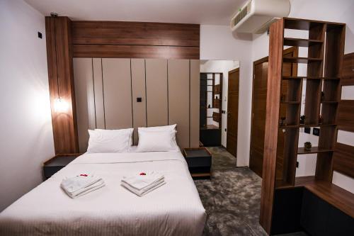 Ένα ή περισσότερα κρεβάτια σε δωμάτιο στο Hotel Necko