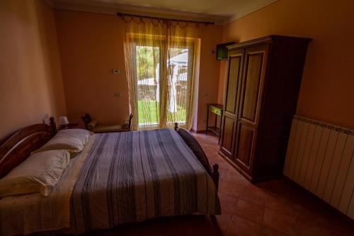 เตียงในห้องที่ casa vacanze in Garfagnana