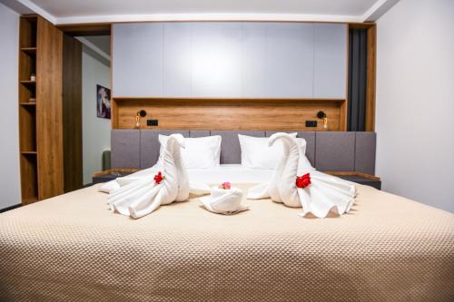 Ένα ή περισσότερα κρεβάτια σε δωμάτιο στο Hotel Necko