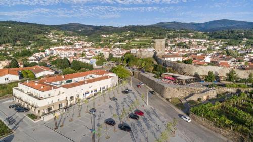 an aerial view of a city with a castle at Novas Direcões in Melgaço