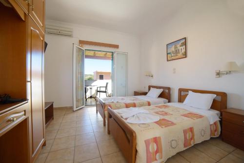 Postel nebo postele na pokoji v ubytování Theodosia Hotel