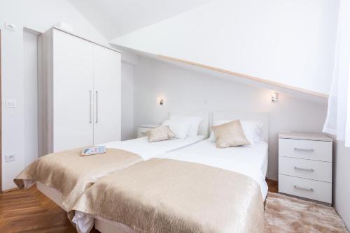 Postel nebo postele na pokoji v ubytování SB Apartment JOY
