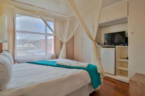 Ένα ή περισσότερα κρεβάτια σε δωμάτιο στο Fisherhaven Travellers Lodge