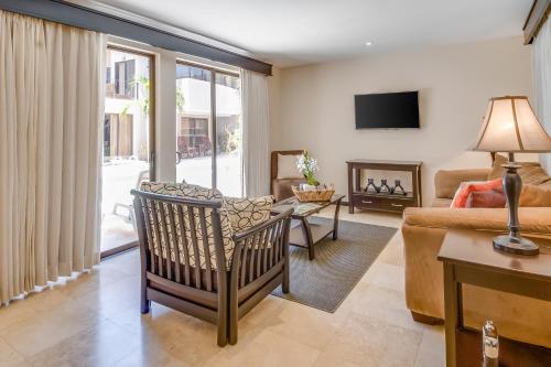 a living room with a couch and a fireplace at The Cove 9 at Playa Ocotal in Coco