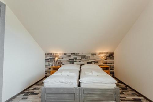 A bed or beds in a room at Chaty Panoráma