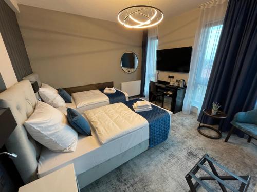 Katil atau katil-katil dalam bilik di Hotel Sanova