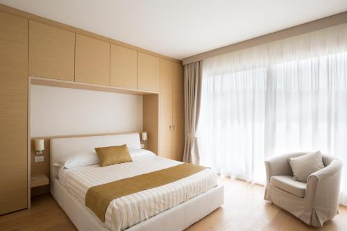 Letto o letti in una camera di Marina di Scarlino Resort