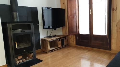 TV a/nebo společenská místnost v ubytování Apartamento Albareda