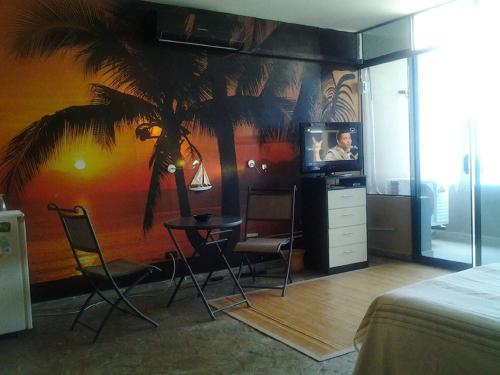 El Merlin - Cabo Blancoにあるテレビまたはエンターテインメントセンター