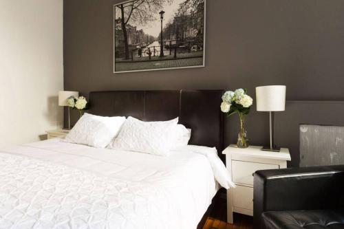 Ένα ή περισσότερα κρεβάτια σε δωμάτιο στο Union Square - Four Bedroom Condo-Hotel Suite
