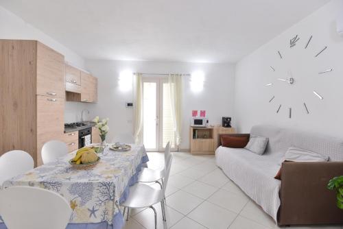 a living room with a table with bananas on it at IzzHome New One in Pula