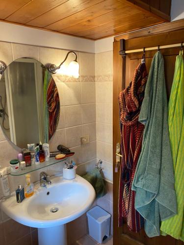 a bathroom with a sink and a mirror at Ca’ Alba in Sestola