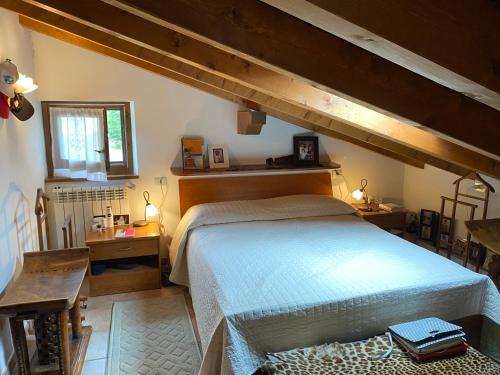 a bedroom with a large bed in a room at Ca’ Alba in Sestola
